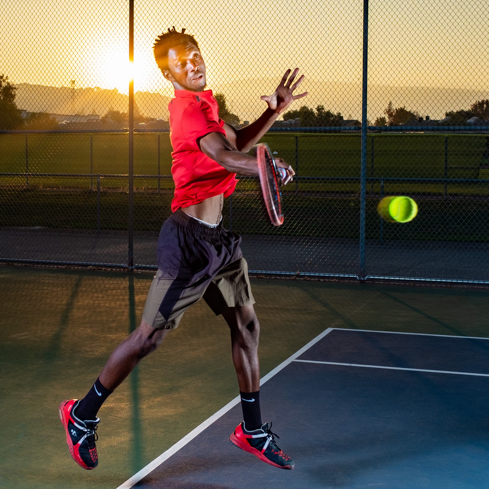 Yssa demonstrating powerful serve technique on court from head to toe